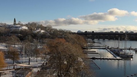 Stockholm, Sweden - January 12 2021: Beautiful winter day in the city. View of the public park called Tantolunden and the small boat harbor, located on the island of Södermalm in Stockholm city.