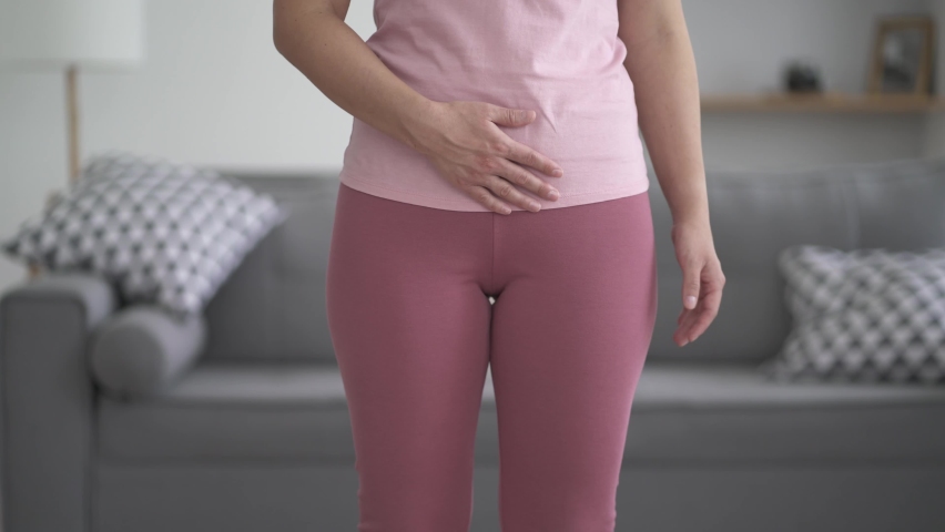 Menstrual pain, woman with stomachache suffering from pms at home, endometriosis, cystitis and other diseases of the urinary system, health problems concept, BeH3althy | Shutterstock HD Video #1082679133