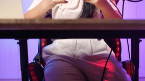 Asian Kid Girl Playing Video Game With Mobile Phone Then Celebrating While Live Stream 
