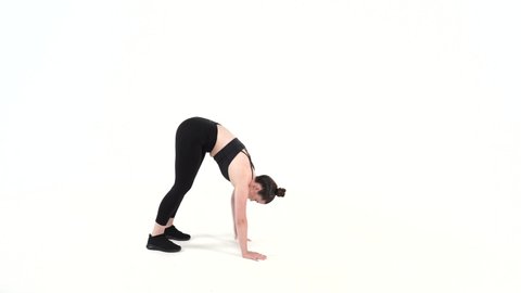 Certified female fitness trainer executes bodyweight exercise on a white background . Upper body Lower body Total Body Exercises for beginners intermediate advanced  levels