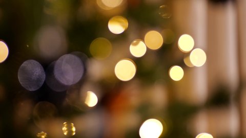 Fairy light on a Christmas tree festive blurred bokeh abstract background 