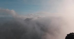 Dramatic 4K time lapse video of mountains in terrific weather with fast moving clouds