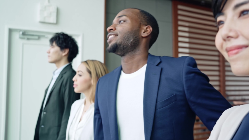 Group of multi racial people standing in the office. Global business. Teamwork of business. Diversity. | Shutterstock HD Video #1082707060