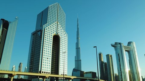 Dubai, United Arab Emirates - November 14, 2021: Beautiful view of Dubai city skyscrapers or skyline along with Burj khalifa. Dubai RTA Metro rail passing through. A view from Sheikh Zayed Road Dubai