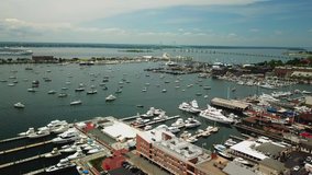 Aerial view of Bannister's Wharf Marina, Goat Island , yachts and Claiborne Pell Suspension Bridge in Newport, Rhode Island.