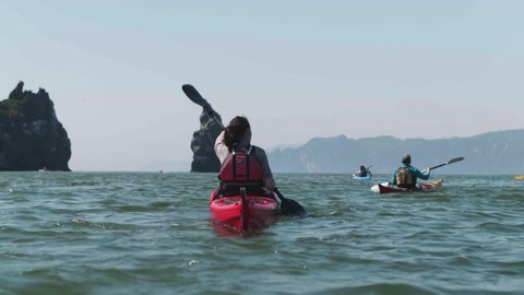 Slow motion first point of view shot of sea kayaking, Kamchatka