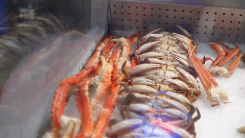 Various kinds of crab fill fishmongers seafood market display case, HD