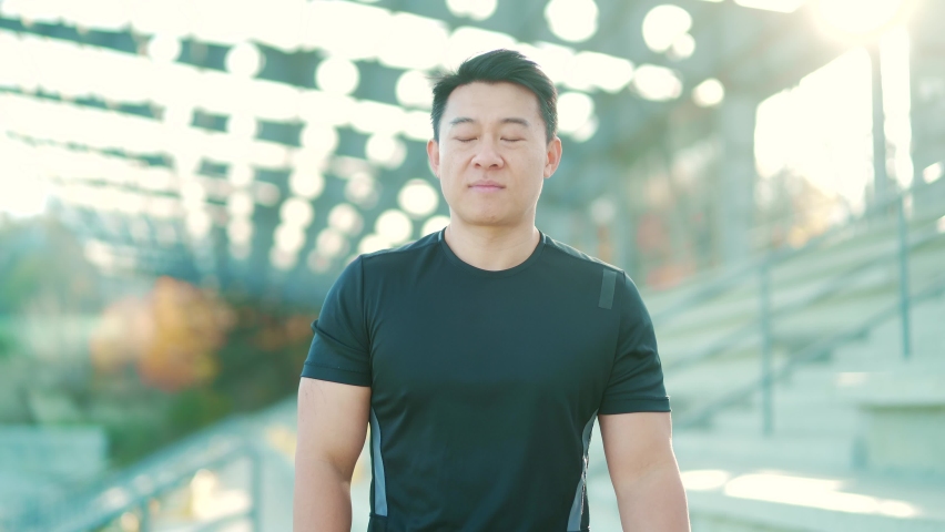 Sport asian man have shoulder pain, injury. Fitness Muscular male sportsman has neck pain and shoulders after running workout having an ache in his arm. athlete runner pain in joints outdoors neck Royalty-Free Stock Footage #1082725369