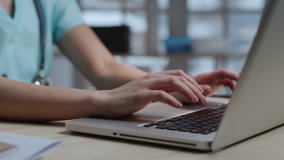 Female Doctor Working on Laptop Typing on Keyboard in Medical Room Close-up. Medical Worker Writes Recipe for Patient on Computer. Nurse Fills Out Medication Prescription. Doctor Online Cabinet Clinic - Powered by Shutterstock - Get 15% off with code: PIKWIZARD15