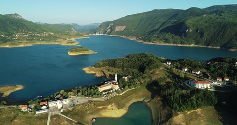 Aerial view of a small village along Rama lake coastline in Bosnia and Herzegovina.
