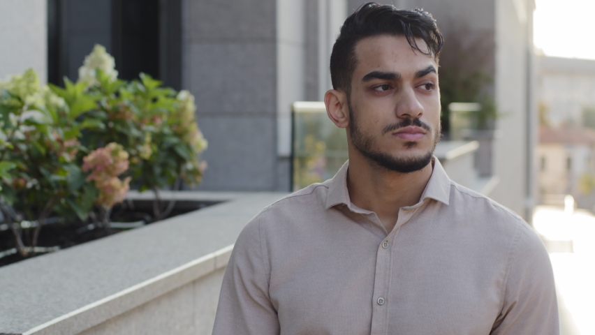 Closeup successful sad serious upset business man bearded guy boss leader thinking about problem walking in city near office company shops building looking around pensive male walks going outdoors Royalty-Free Stock Footage #1082736445