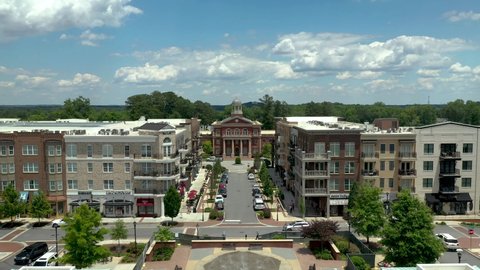 Drone shot slowly approaching city hall in Alpharetta, Georgia in the summer time.