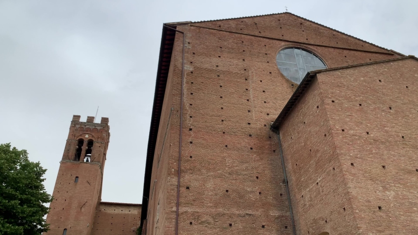 Low angle shot of Basilica Di San Domenico in Siena, Tuscany, Italy, with cloudy sky