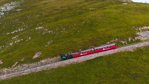 Brienz , Bern , Switzerland - 09 13 2021: Aerial: steam rack railway getting to the summit station