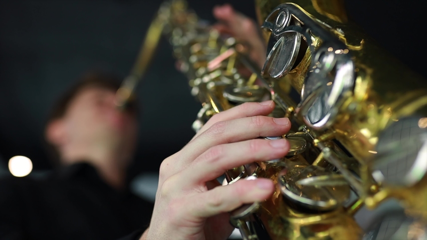 student learning to play on saxophone in the room Royalty-Free Stock Footage #1082743132