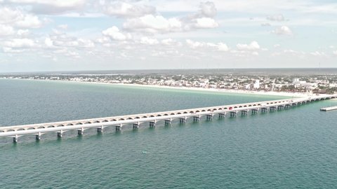 Aerial shot of puerto progreso beach and highway which connects yucatan 
