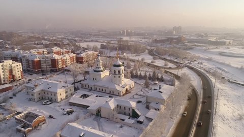 Russia, Irkutsk - January 20, 2021; Znamensky Convent in Irkutsk. Aerial drone flight. Tourist hotels and restaurants. In winter, the Russian city is covered with ice and snow.