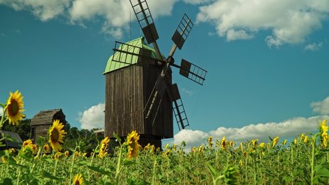 Wooden windmill in Ukrainian traditional village.