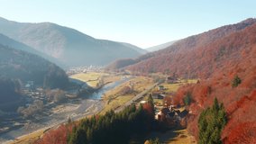Amazing view of the river flowing in a mountain valley. Shooting from a quadcopter. Carpathian mountains, Ukraine, Europe. Cinematic aerial shot. Discover the beauty of earth. Filmed 4k, drone video.