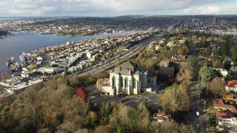 Cinematic 4K aerial drone footage of Saint Mark's Episcopal Cathedral on Capitol Hill, Eastlake, Lake Union, Union Bay near downtown Seattle, Washington