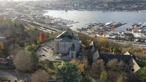Cinematic 4K aerial drone orbiting footage of Saint Mark's Episcopal Cathedral on Capitol Hill, Eastlake, Lake Union, Union Bay near downtown Seattle, Washington
