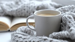 Close up video. Steaming coffee cup on a rainy day window background. cozy atmosphere, in cold weather calm background. Rainy Day Mood. selective focus, soft focus