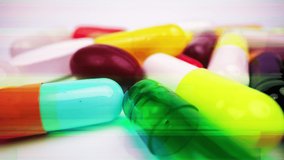A macro shot of a collection of medicine pills and tablets with a crazy jittery glitching frame effect psychiatric  - Powered by Shutterstock - Get 15% off with code: PIKWIZARD15