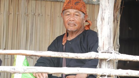 Indonesian man wearing Sesingal a traditional headband by using the Tidung tribe. Its part of the cultural program in Tarakan, Kalimantan Utara, Indonesia. Tarakan, Indonesia. Nov, 22,2021