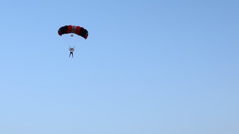 Ecka, Vojvodina, Serbia - August 21, 2021: National Parachuting Championship, parachutist it slows down for accurate landing on target place. Skydiving, gliding, parachute jump.