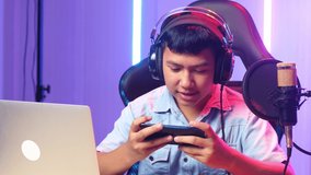 Asian Kid Boy Playing Video Game With Mobile Phone Then Lose The Game While Live Stream 
