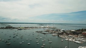 Aerial view of Goat Island Marina, yachts and Claiborne Pell Suspension Bridge in Newport, Rhode Island.