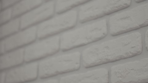 Abstract white brick background. Wall facade of white brick wall background. Wall from white brick. Detailed close up.