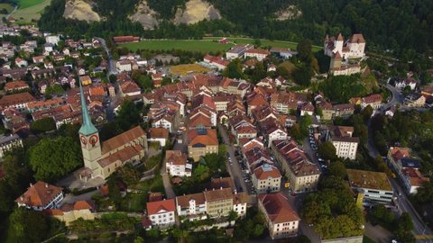Aerial  around the old town of the city Burgdorf in Switzerland on a late afternoon in summer.