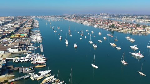 Newport Beach Harbor, with sailboats on a calm day.