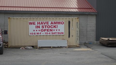 Sign on rural road advertising ammo in stock.