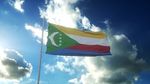Flag of Comoros waving at wind against beautiful blue sky