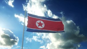 Flag of North Korea waving at wind against beautiful blue sky