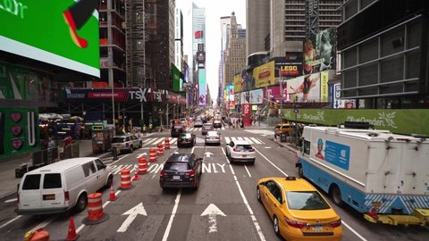 NEW YORK CITY, USA - OCT 21, 2021: Advertisement billboards Time Square Manhattan, New York City. NYC is a modern urban business city in USA, iconic landmark of American tourism. Low angle drone view 