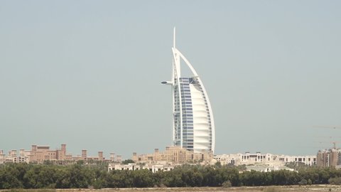DUBAI, UNITED ARAB EMIRATES - CIRCA 2021: The Burj Al Arab hotel seen from the Al Barsha district