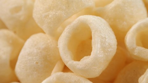 Hula hoops crisps snack extreme close up rotating very slowly stock footage
