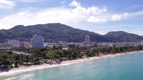 Patong beach phuket thailand. Top view drone shots sea and sand beach on a summer day. 4K Aerial view popular beach famous tourist travel vacation. Cityscape, landscape, panoramic video intro 4k.