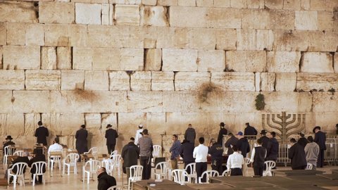 Jerusalem, Israel – Nov 22, 2021: Religious Jews praying together in Western Wall,  Wailing Wall, Kotel in Jerusalem. Religious Jews praying in Jerusalem's western wall. The most sacred place for jews