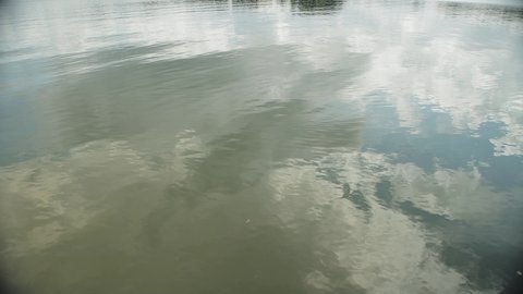 Water surface on the water of the river in the wind. Background, texture