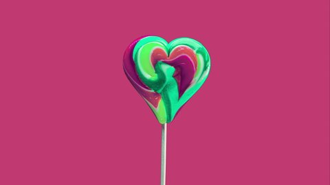 Stop motion animation lollipops on a modern background. Sweet candy spiral heart, caramel candy
