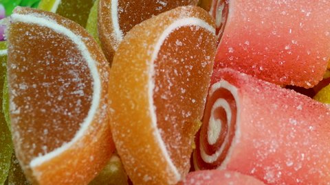 Close-up of orange marmalade and lemon, a delicious mix of sweets and sweets for children.