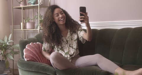 Young adult female using a smartphone for a video call