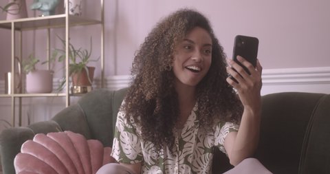 Young adult female using a smartphone for a video call
