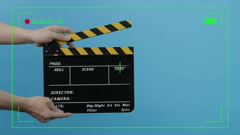 Movie Clapper Board. Hollywood Director Film Slate. Film crew hold and clapping film slate in video recording. Using for cut action or visual effects and scene prop. Clapperboard of movie production.