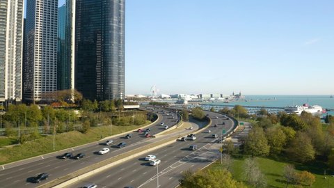 Cars Driving on Jean Baptiste Point DuSable Lake Shore Drive in Early Autumn. Chicago, Illinois