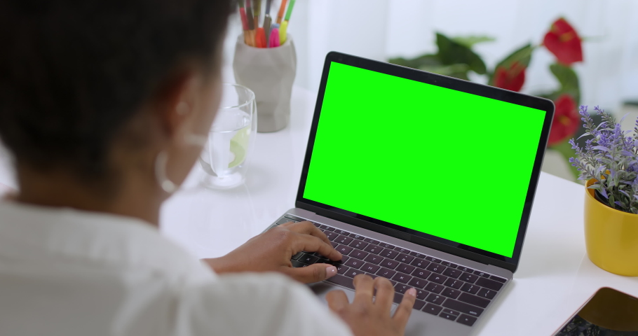 
Over the Shoulder Shot of African American Business Woman Typing on Laptop, Young Female Professional Writing an Important Email From Her Home in Modern Living Room. Remote Working. Green Screen. Royalty-Free Stock Footage #1082868169